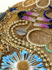 Collection of various bracelets on a wooden surface